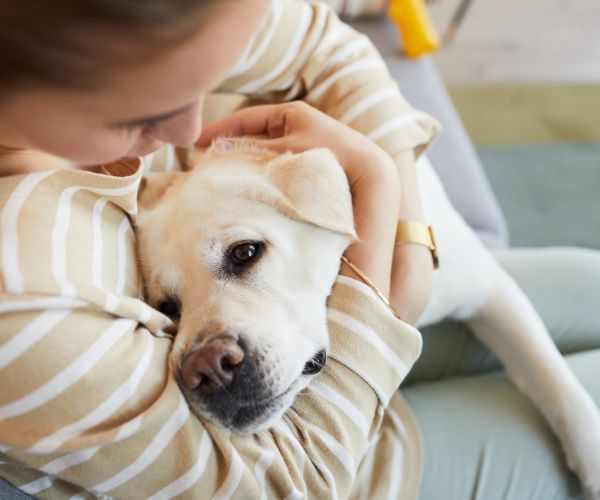 A woman hugging a dog